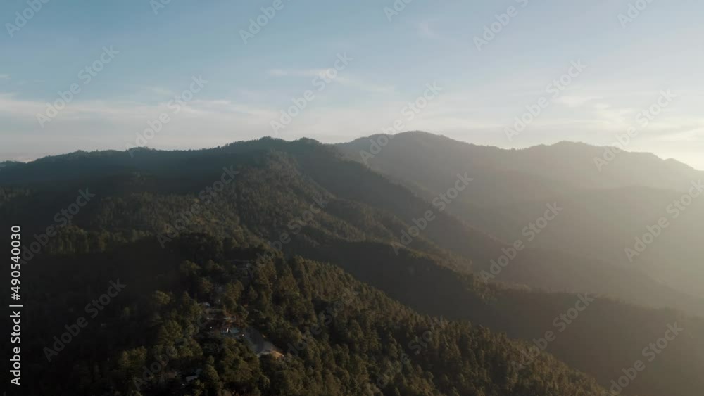 Aerial overview of Sierra San Jose del Pacifico in Oaxaca, southwest Mexico at daytime. Beautiful mountain range with lush green vegetation. Aerial overview of Sierra San Jose del Pacifico in Oaxaca, southwest Mexico at daytime. Beautiful mountain range with lush green vegetation.