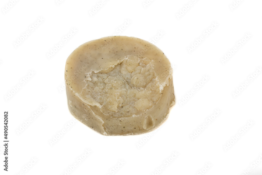 Handmade natural soap bar with mint, nettle and castor oil. Dry shampoo for oily hair. Close up, isolated on white background. Handmade natural soap bar with mint, nettle and castor oil. Dry shampoo for oily hair. Close up, isolated on white background.