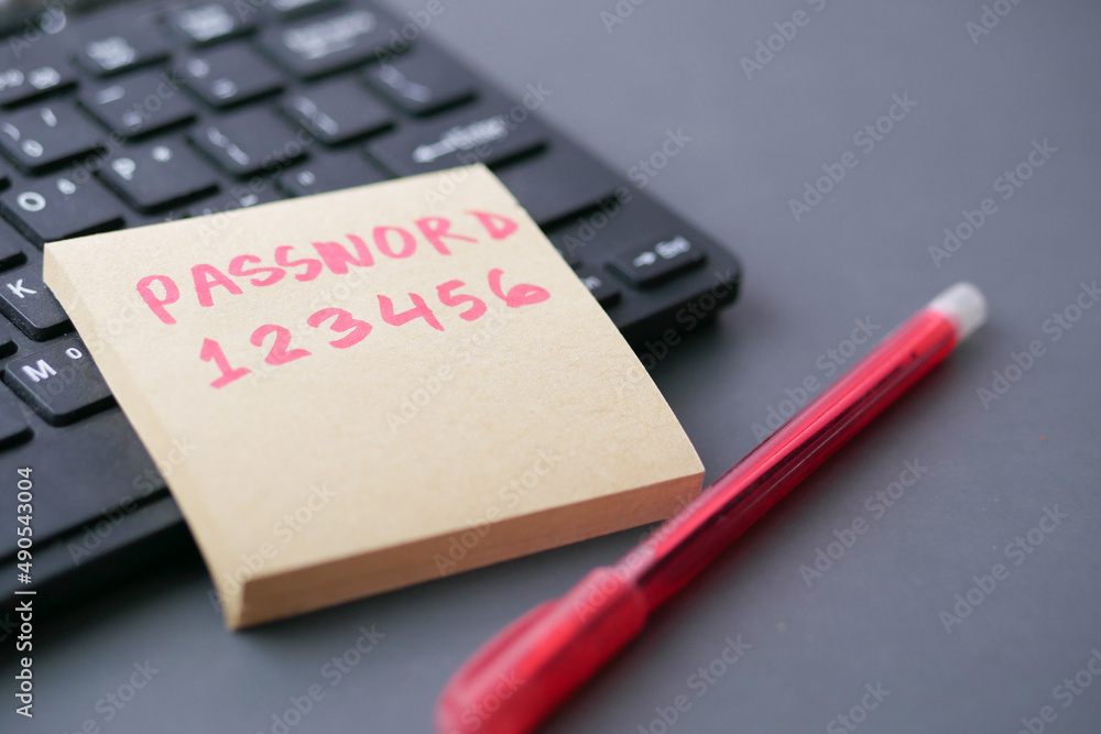 writing password on a sticky note writing password on a sticky note