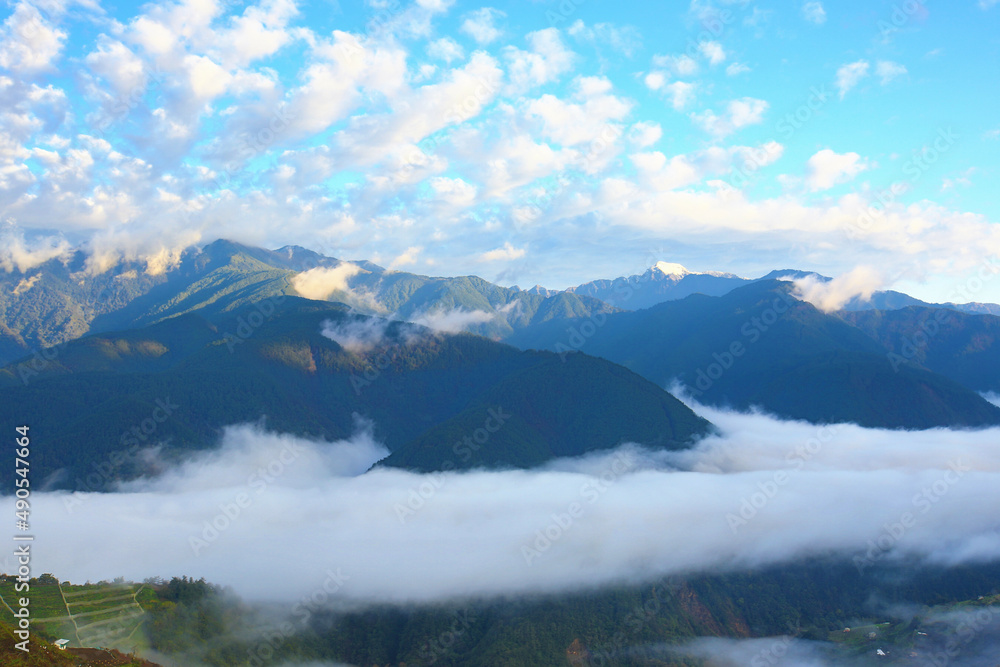 Beautiful landscape of continuously mountains with amazing sky clouds and cloud sea at dawn