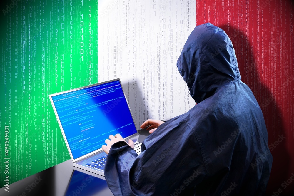Anonymous hooded hacker, flag of Italy, binary code - cyber attack concept Anonymous hooded hacker, flag of Italy, binary code - cyber attack concept