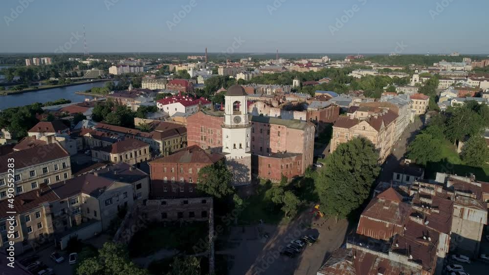 Aerial view of a medieval clock tower in heart of Vyborg old town. Panoramic cityscape Aerial view of a medieval clock tower in heart of Vyborg old town. Panoramic cityscape
