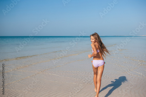 beautiful girl having fun on tropical seashore