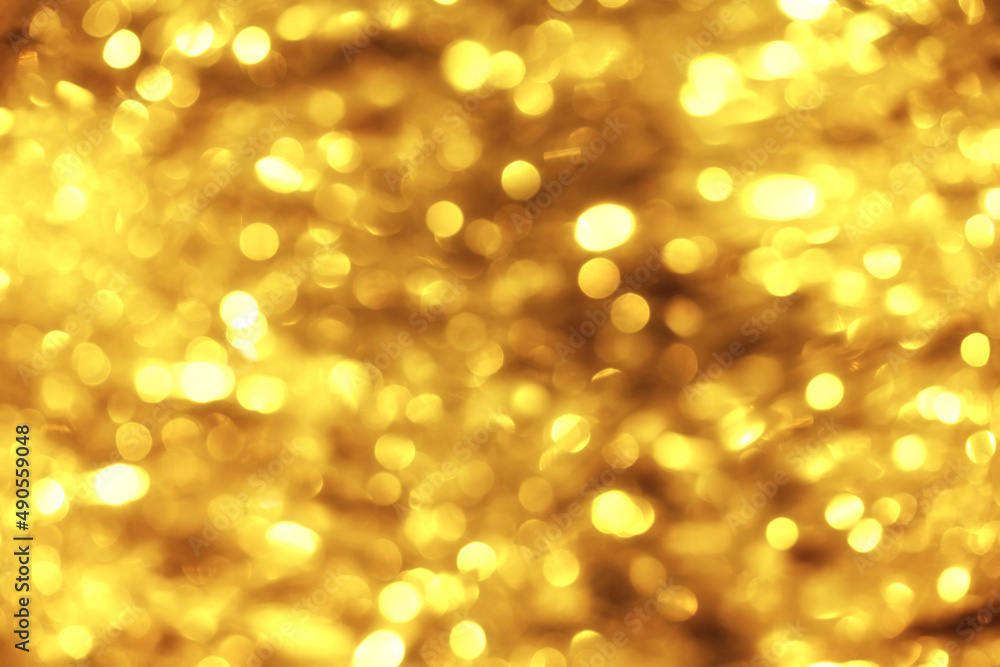 Defocused festive golden lights bokeh abstract background