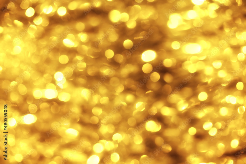 Defocused festive golden lights bokeh abstract background Defocused festive golden lights bokeh abstract background