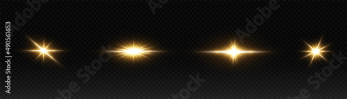 A set of flares, bright lights and sparkles on a black background. Golden flashes and glare. Abstract golden isolated lights Bright rays of light. Glowing lines.
