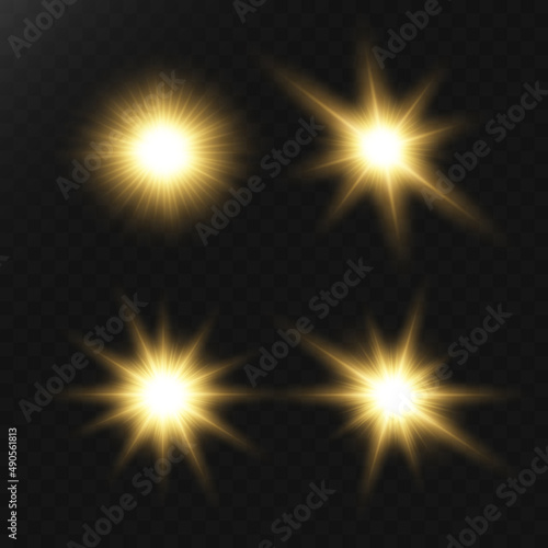 A set of flares, bright lights and sparkles on a black background. Golden flashes and glare. Abstract golden isolated lights Bright rays of light. Glowing lines.