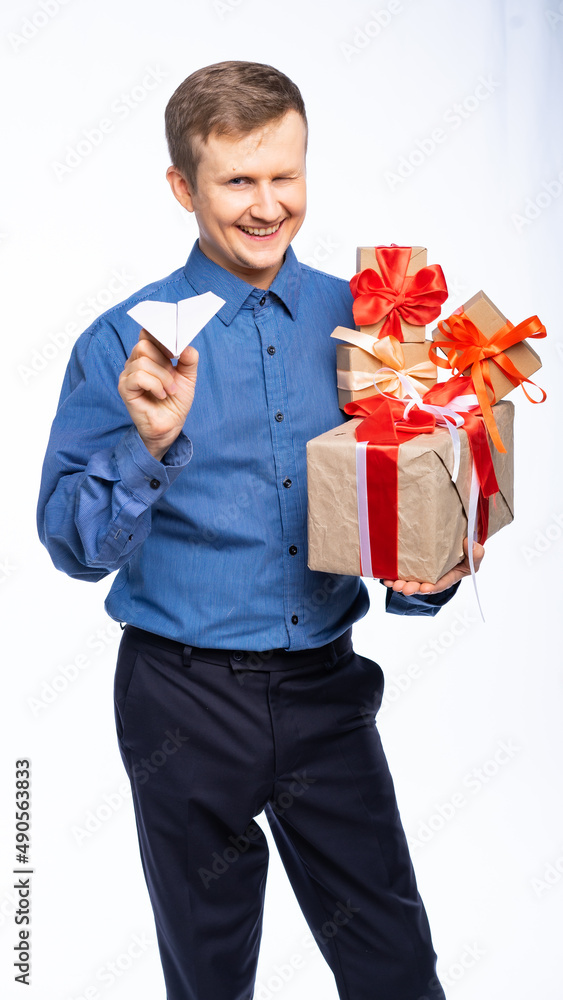 man with gifts on a white, isolated background, rejoices, is surprised, laughs man with gifts on a white, isolated background, rejoices, is surprised, laughs