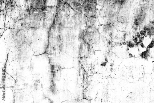 Cracked white concrete wall surface with scattered grunge texture for background