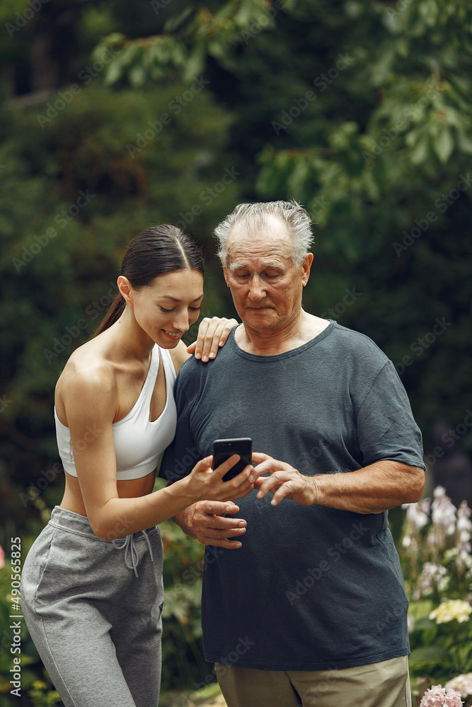 Portrait of happy handsome older man using smartphone Portrait of happy handsome older man using smartphone