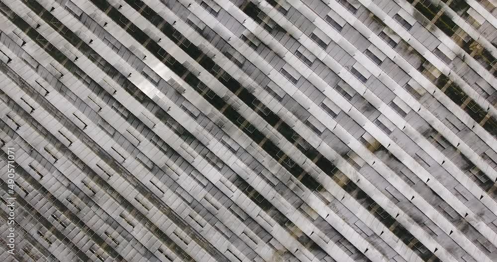 Top view of the glass roof of a large modern greenhouse Top view of the glass roof of a large modern greenhouse