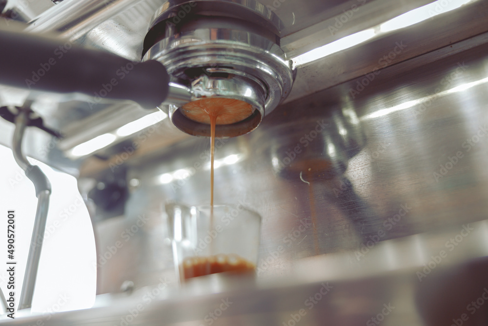Close up of coffee machine preparing espresso Close up of coffee machine preparing espresso