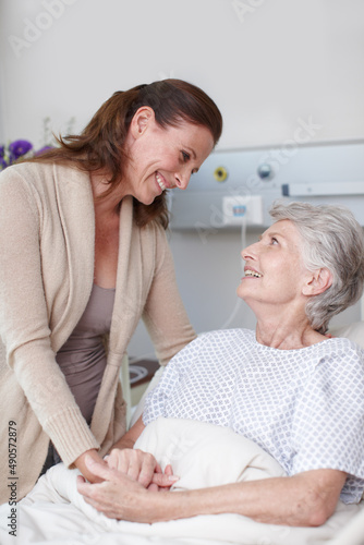 The operation was a success. An affectionate daughter visiting her sick mother in the hospital. © Stigur/peopleimages.com