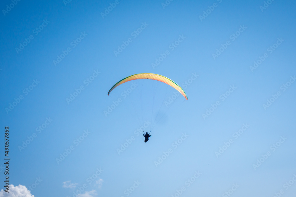 paragliding flight in the mountains. Le Grand-Bornand, France paragliding flight in the mountains. Le Grand-Bornand, France