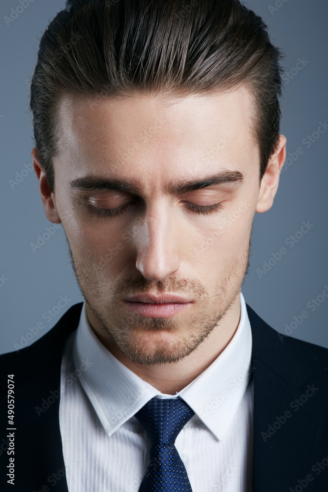 Hes got style. Cropped shot of a handsome and fashionable young man posing in the studio. Hes got style. Cropped shot of a handsome and fashionable young man posing in the studio.