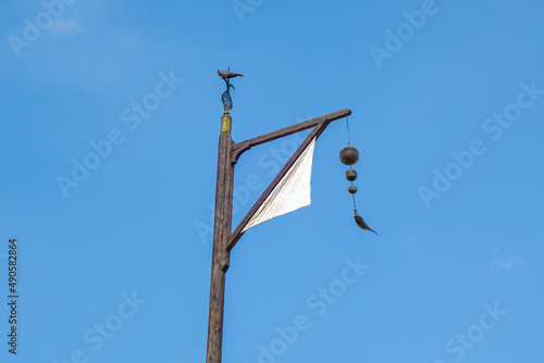 Flagpole with a tug - a banner over the grave of a Muslim saint. Shot at Bahauddin Naqshband Mausoleum, Bukhara, Uzbekistan photo