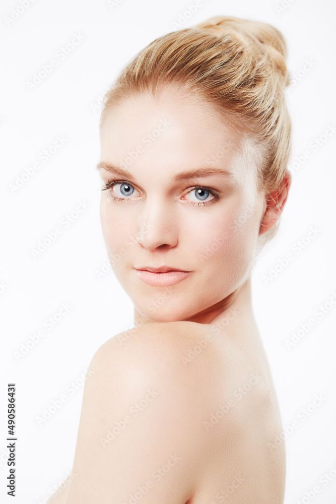 Dare to go bare. Portrait of a beautiful woman looking over her shoulder. Dare to go bare. Portrait of a beautiful woman looking over her shoulder.