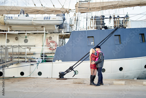 Romantic middle-aged couple embracing the port