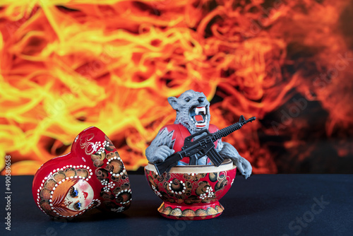Photography Armed monster with an evil grin jumps out of a matryoshka doll