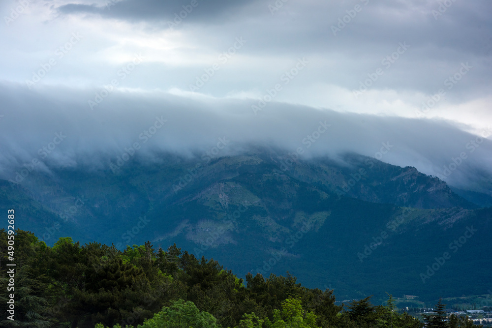 fog over the mountains. low clouds fog over the mountains. low clouds