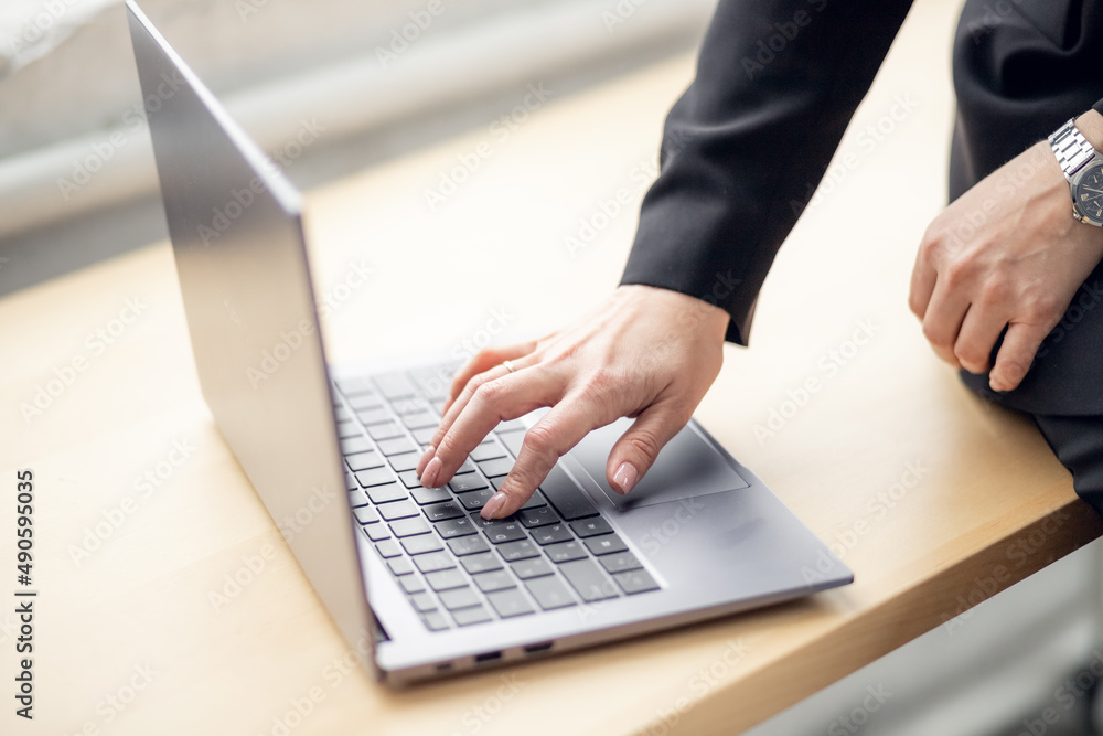 female hand is typing on laptop keyboard. work at the computer in the office. online, international business, sanctions. investments, freelance, accounts. surfing and shopping on the Internet. female hand is typing on laptop keyboard. work at the computer in the office. online, international business, sanctions. investments, freelance, accounts. surfing and shopping on the Internet.
