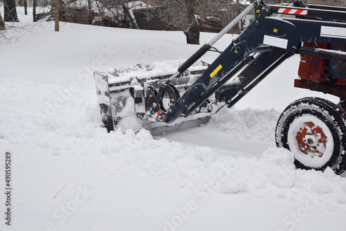 Tractor clearing snow