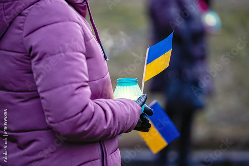 Wallpaper Mural Ukrainian flags, candles and torches in the hands of protesters at the rally "Stand With Ukraine", closeup Torontodigital.ca