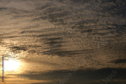 Sunset with cloudy sky background, beautiful sky image at summer sunset.