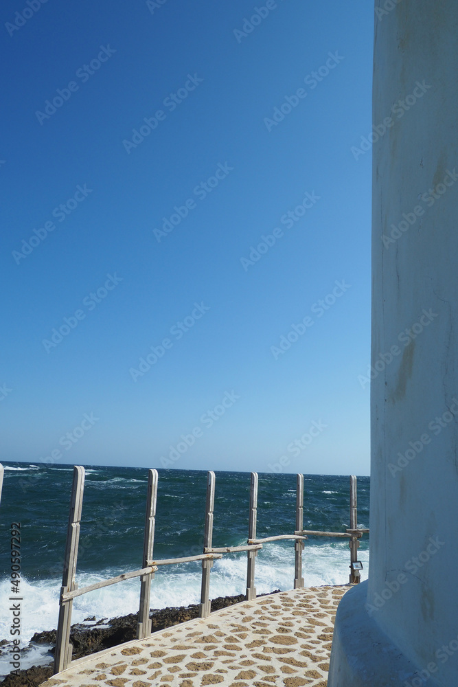 Obraz premium Famous landmark windmill near Molos area overlooking the Aegean deep blue sea, Skiros island, Sporades, Greece
