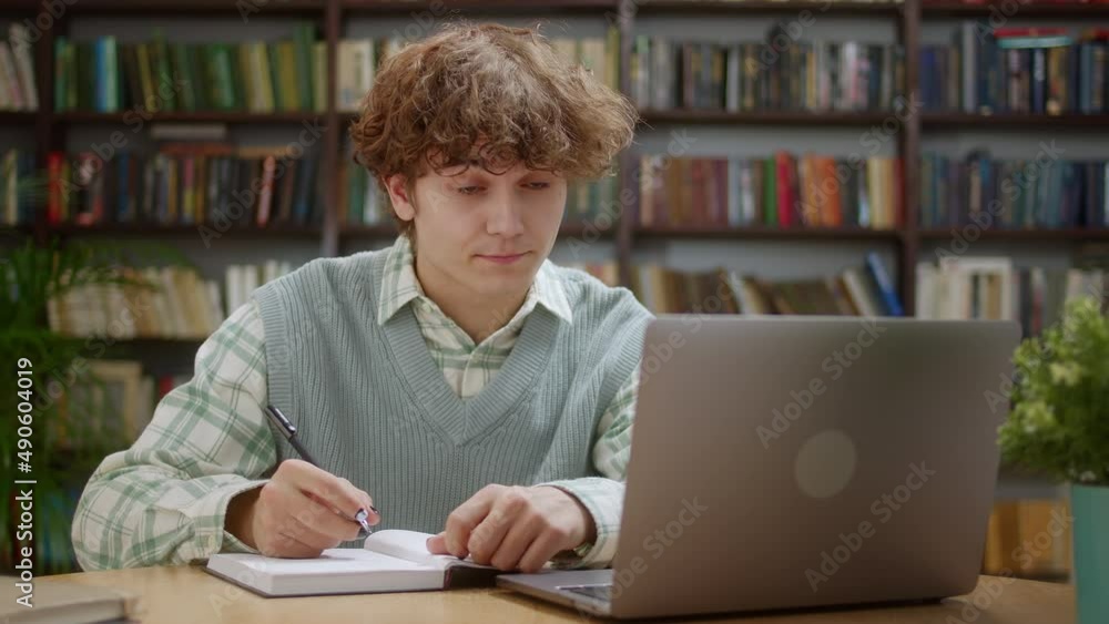 Smiling Young Man Student Study With Online Tutor Teacher Talk Conference Calling do Video Chat Learn Language Make Notes Sit at Home Office Desk Look at Laptop Computer Smiling Young Man Student Study With Online Tutor Teacher Talk Conference Calling do Video Chat Learn Language Make Notes Sit at Home Office Desk Look at Laptop Computer