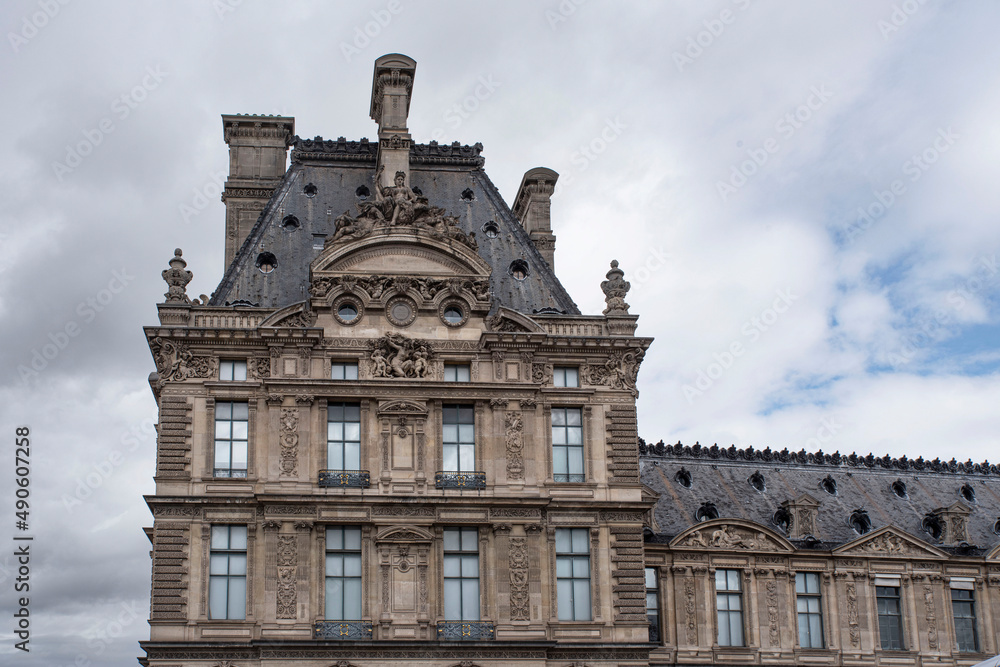 Detail of the exterior architecture of the Louvre in Paris with its sculptures and statues