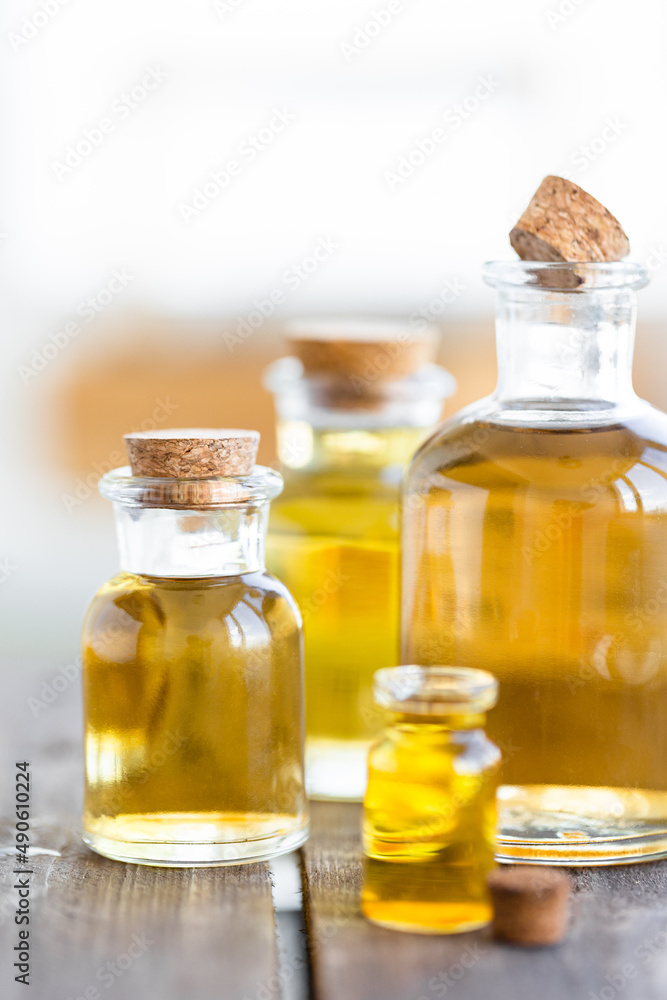 Assortment of organic essential oils. Natural moisturizing body and face treatment. Plant extract for healthy young skin. Relaxation, aromatherapy, salon spa. Close up, macro view Assortment of organic essential oils. Natural moisturizing body and face treatment. Plant extract for healthy young skin. Relaxation, aromatherapy, salon spa. Close up, macro view