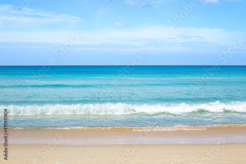 Seascape. Clear azure sea with sandy beach and blue sky on the horizon. Travel and tourism, sea recreation