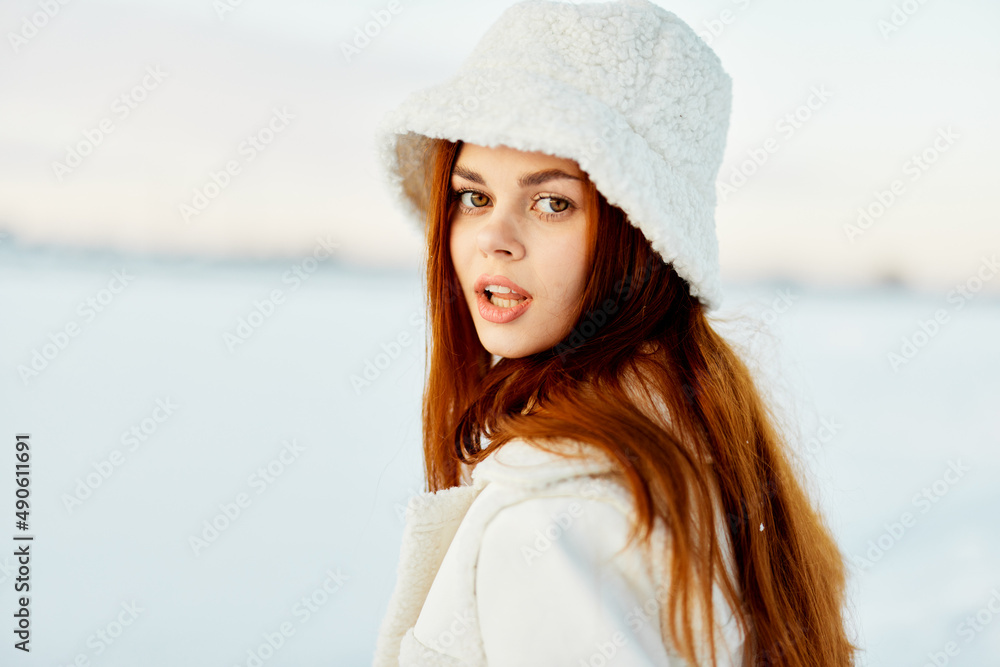 pretty woman in a white coat in a hat winter landscape walk nature pretty woman in a white coat in a hat winter landscape walk nature