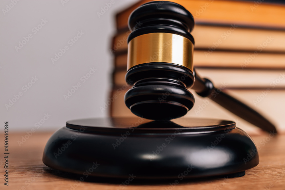 gavel of justice with wooden and book background with copy-space gavel of justice with wooden and book background with copy-space