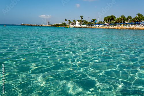 Fototapeta Naklejka Na Ścianę i Meble -  Crystal clear blue water of Mediterranean sea on Nissi beach in Ayia Napa, Cyprus