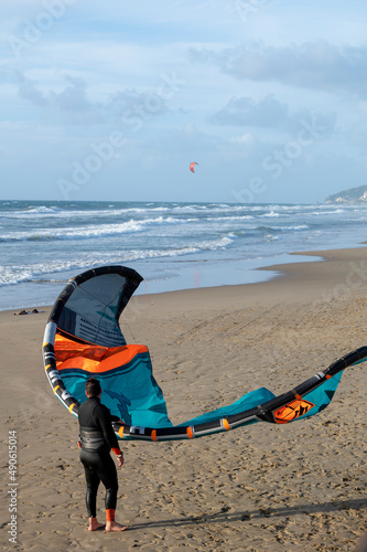 Water sport at cold winter water of Tyrrhenian sea between two touristic towns Sperlonga and Terracina in Lazio, Italy