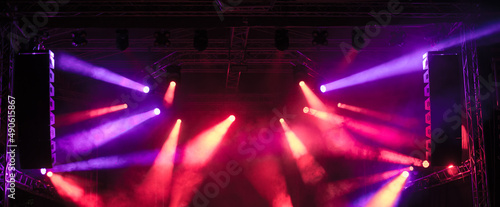 Spot lights on the stage during night concert in summer © Solid photos