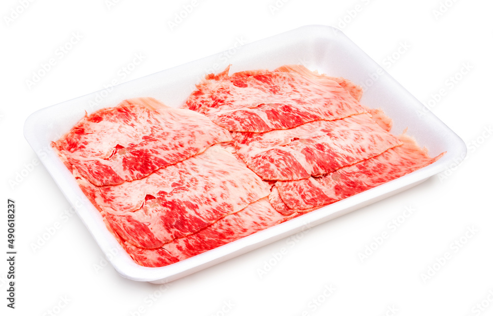 Rare Sliced beef with marbled texture in package, Meat red beef on black background, Asian BBQ food style. Rare Sliced beef with marbled texture in package, Meat red beef on black background, Asian BBQ food style.