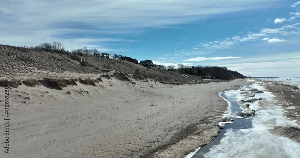 Winter on the beach with many different layers of frozen lake Michigan. drone footage Winter on the beach with many different layers of frozen lake Michigan. drone footage