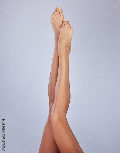 My bodys perfect right down to my toes. Cropped shot of an unrecognizable woman showing her legs while posing in the studio.