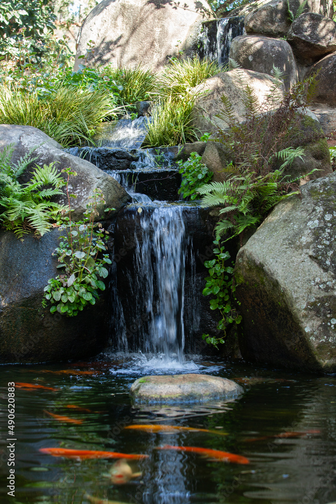 small waterfall on a lake in the city in sunny day small waterfall on a lake in the city in sunny day