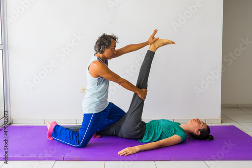 Vászonkép Traditional Thai Massage stretch for the hamstring muscles (thigh and leg)