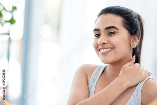Free Download That skincare really paid off. Shot of young woman smiling happily. - GFXLoad