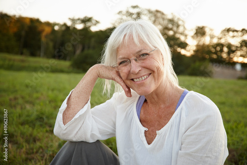 Getting away from it all. Portrait of an attractive mature woman relaxing in nature.
