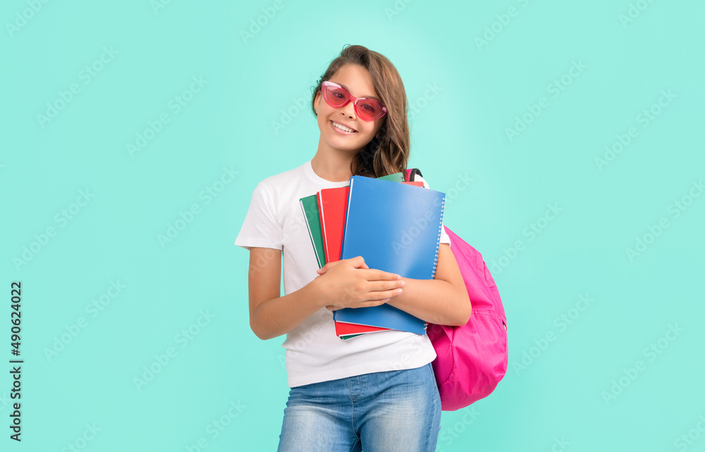 student child with school bag. high school. happy teen girl carry backpack and notebook student child with school bag. high school. happy teen girl carry backpack and notebook