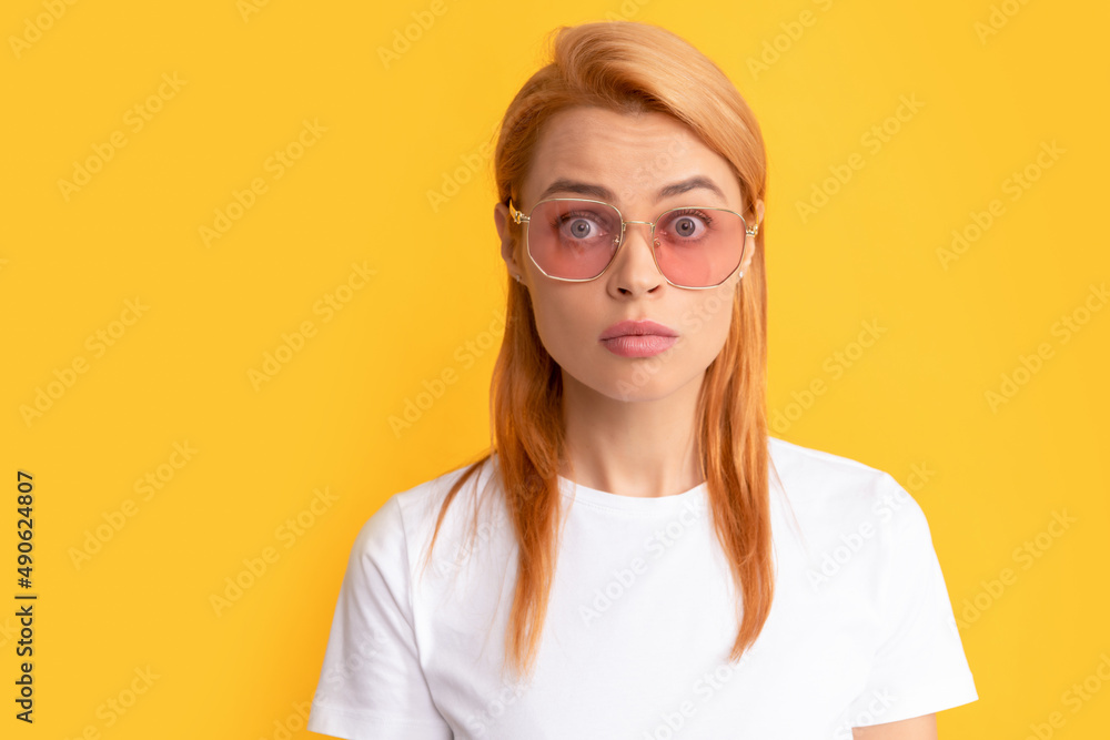 portrait of amazed young woman in glasses, fashion