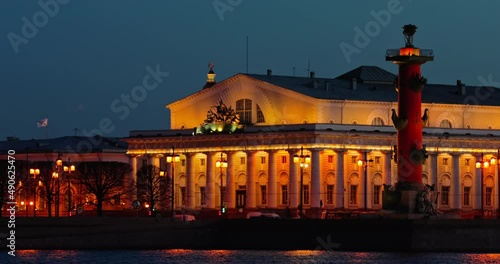 Russia, Saint-Petersburg in dusk, landmarks of city in night illumination, Rostral Columns, Palace Bridge, reflections on water, Admiralty building, Isaac cathedral photo