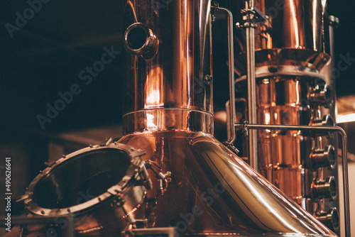 close up of copper whiskey still photo