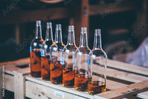 whiskey bottles with descending levels of fullness